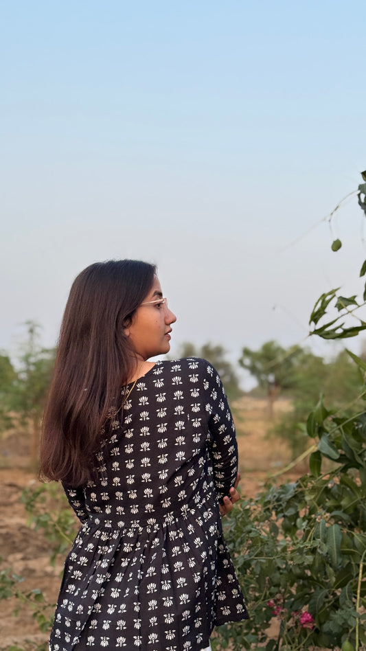 WHITE LOTUS BLACK PEPLUM TOP